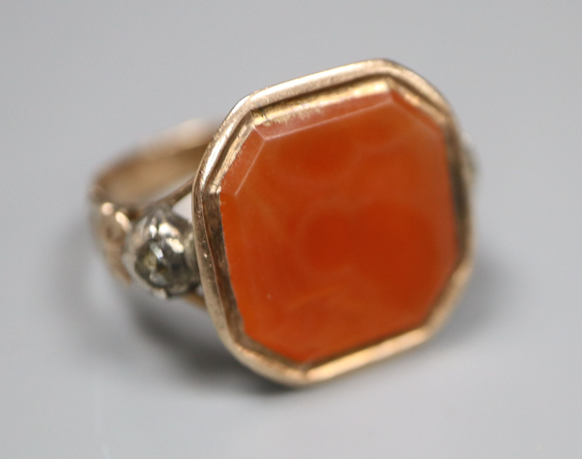 A Georgian yellow and white metal, octagonal carnelian and rose cut diamond set ring, size R/S, gross 6.1 grams.